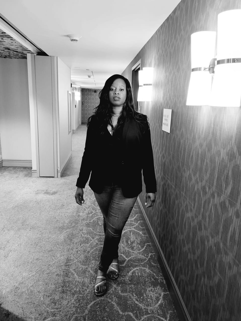 Lexiti, founder of Lexitidream Photography — editorial black-and-white portrait